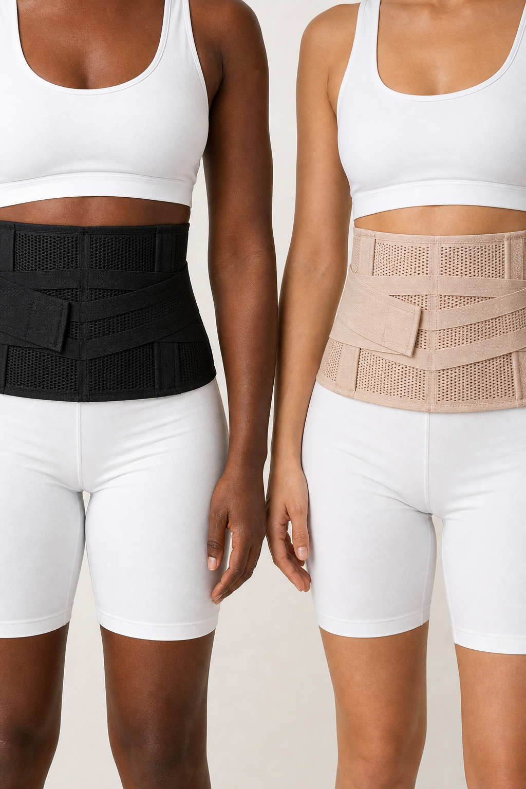 Black and nude Grace Tummy Bands showing the breathable mesh and crossing straps